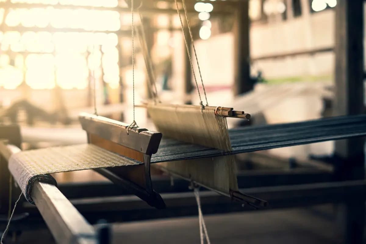 Traditional loom operating in a textile production workshop